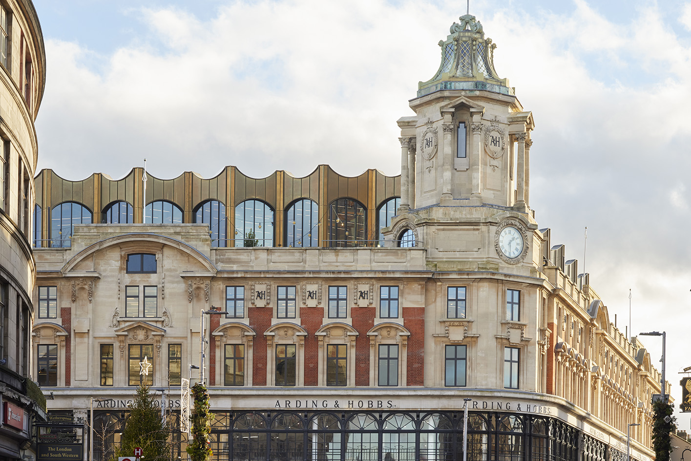 the redesigned Arding & Hobbs, one of the reborn department stores of london, showing off a new timber wrapped core and added rooftop areas