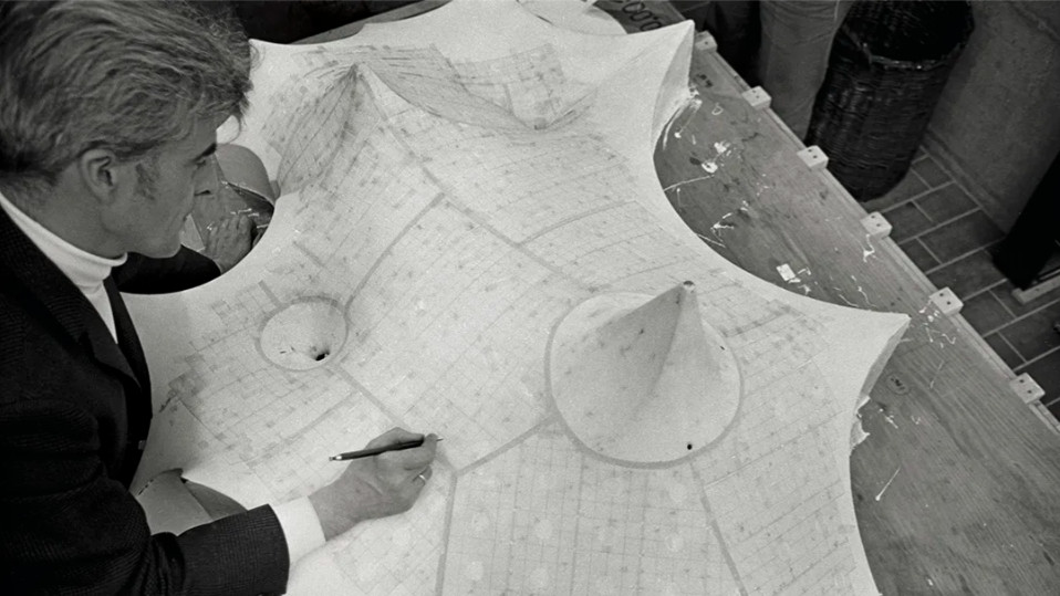 Frei Otto with the model for the roofing of the Olympic Park&rsquo;s swimming hall, Munich, c. 1970