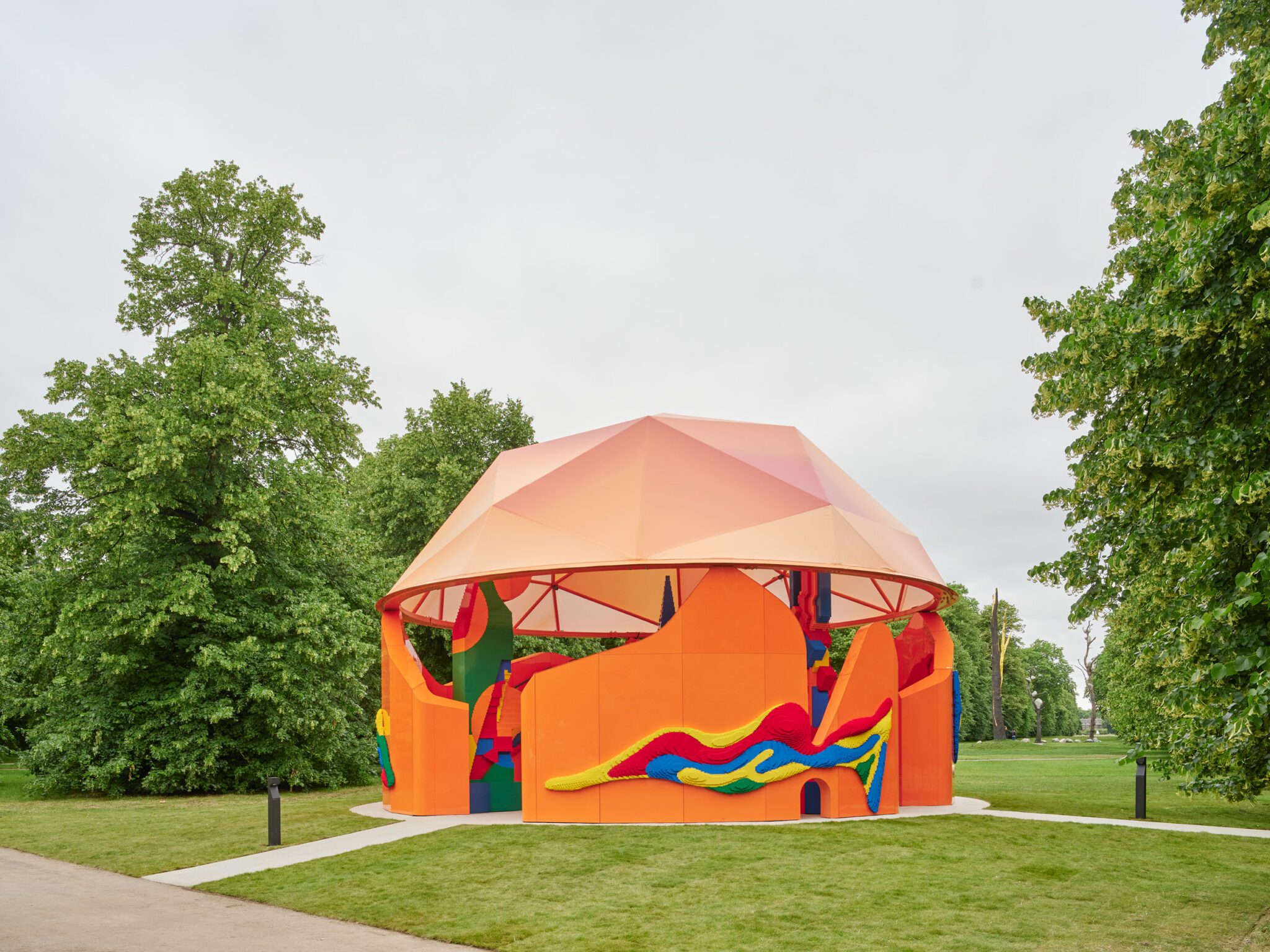play pavilion, a colourful structure in the greenery of london