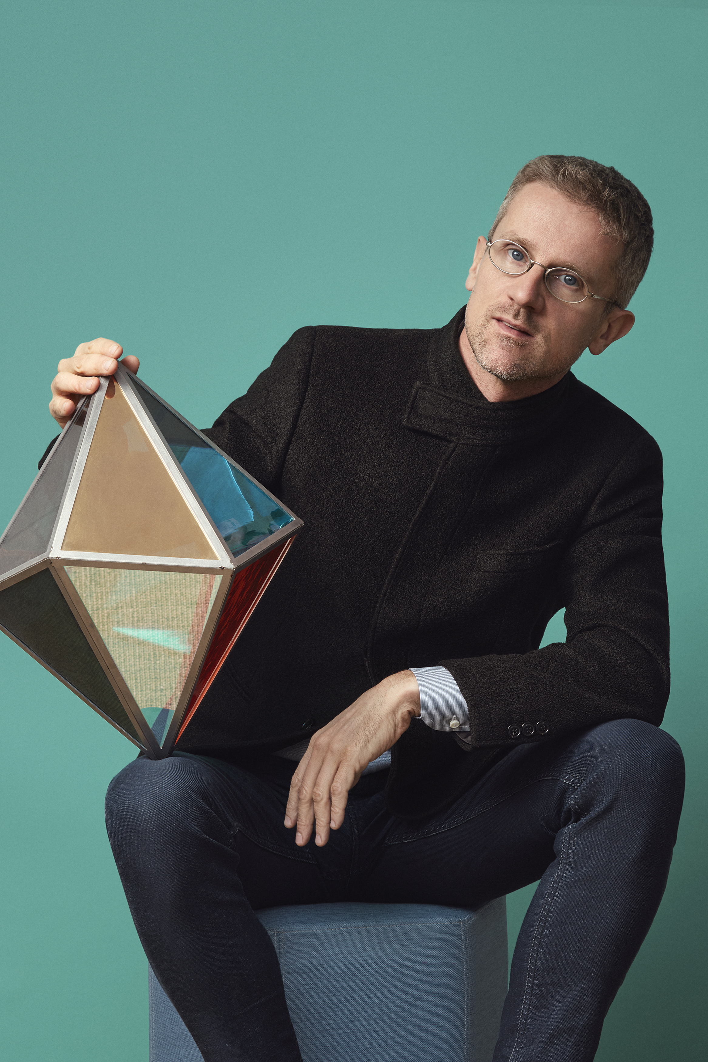 Carlo Ratti portrait holding a piece of lighting design