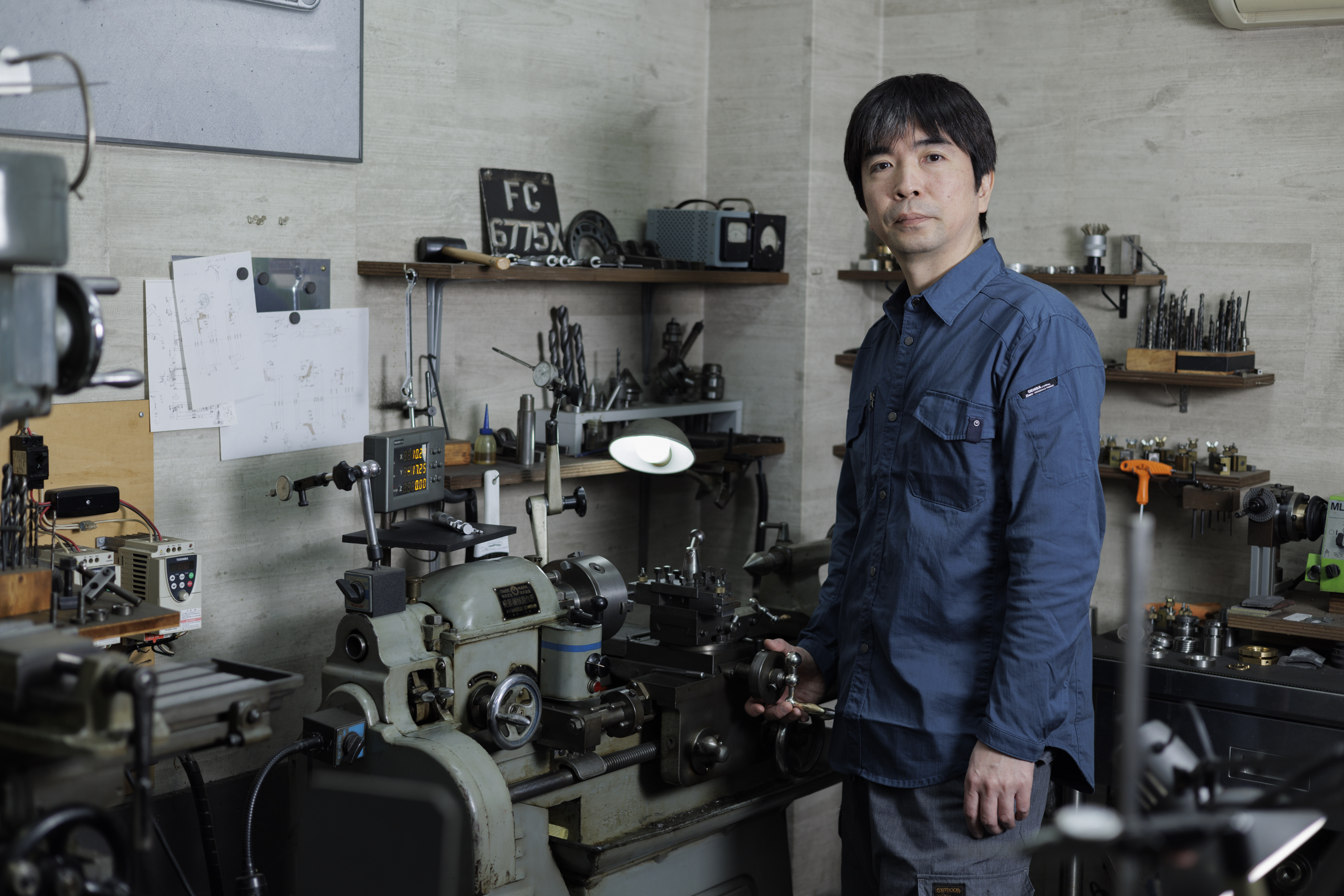 man in front of work bench